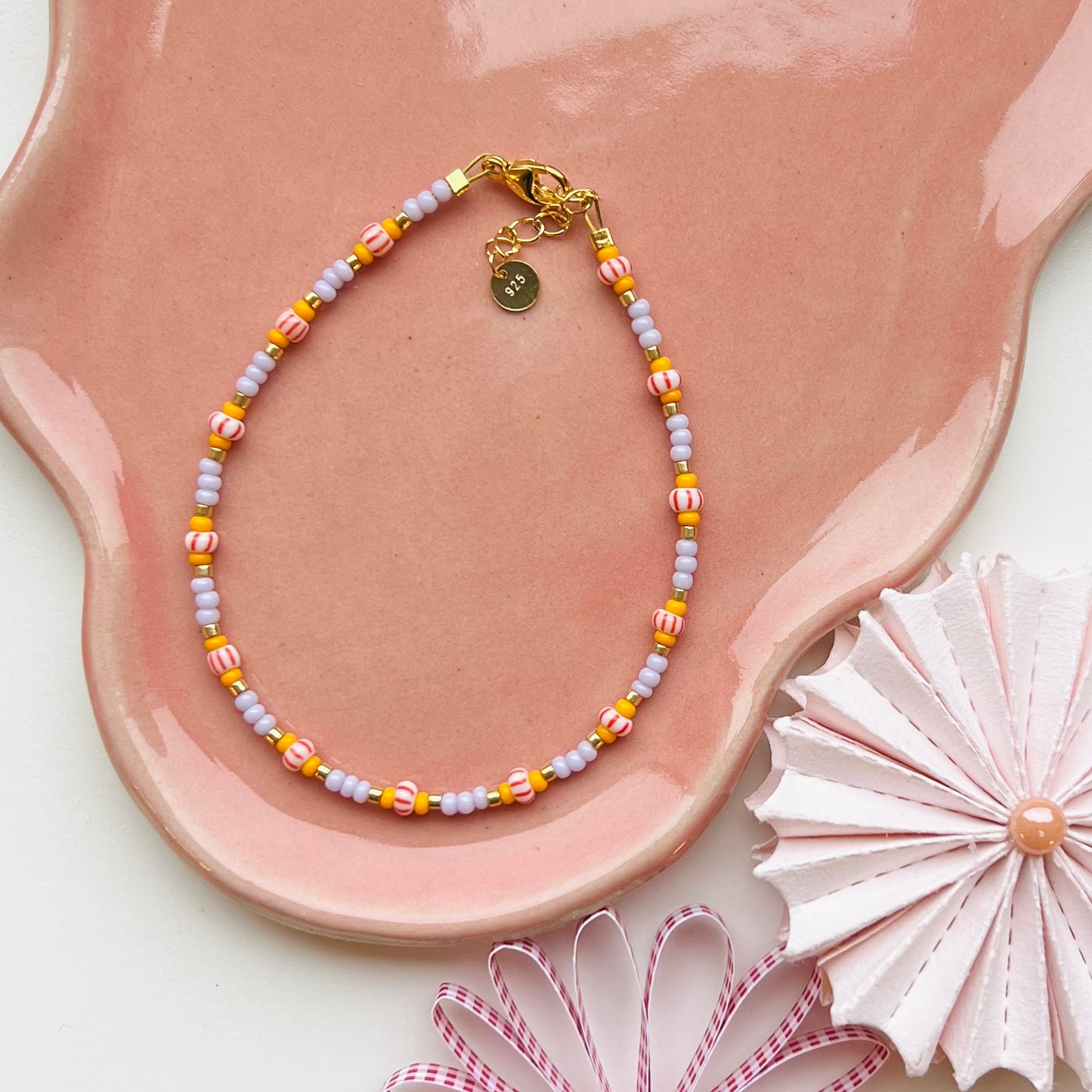 Lilla/Orange Armbånd