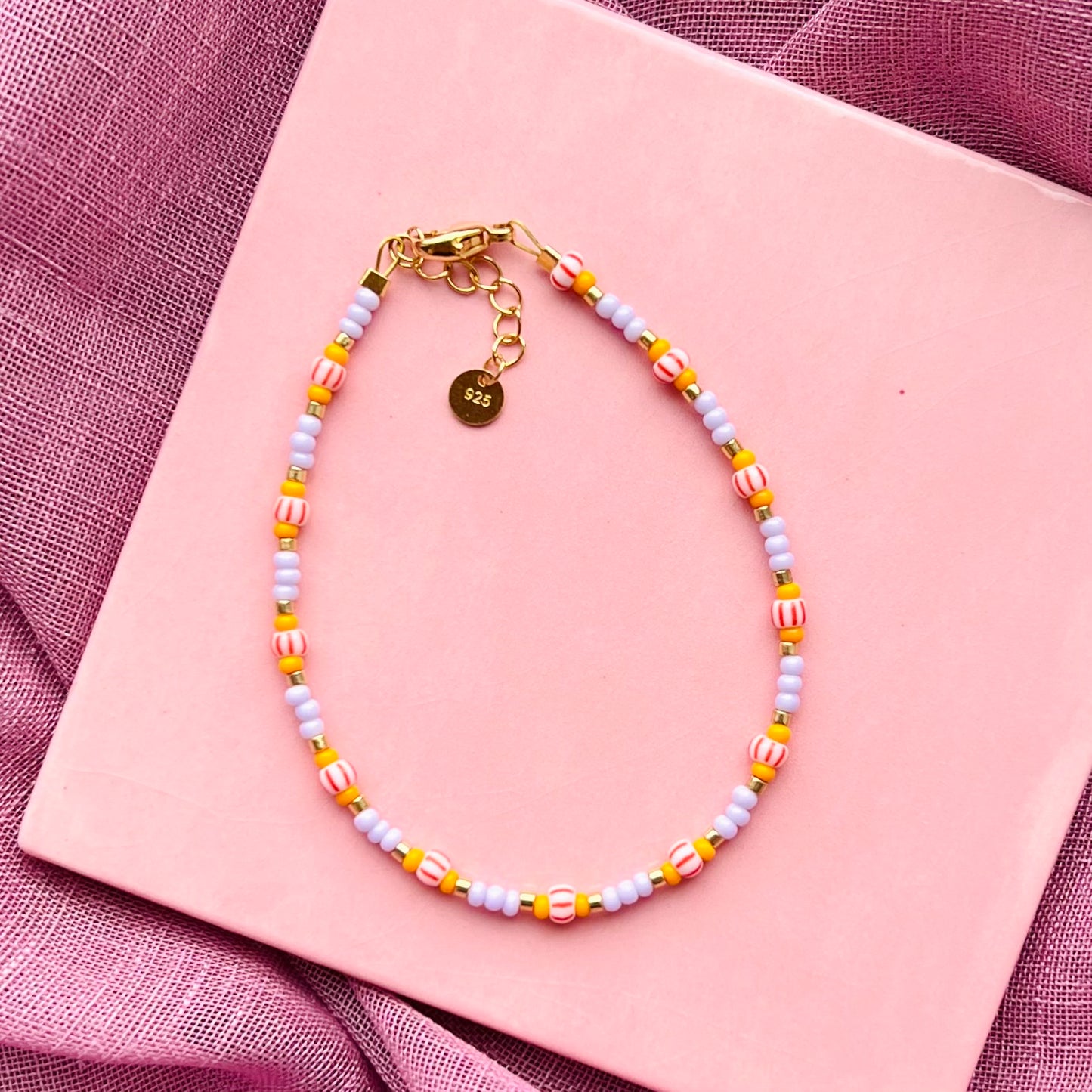 Lilla/Orange Armbånd